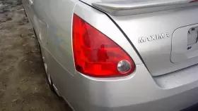 166-59595L NISSAN Driver Lh Tail Light Outer Lamp Quarter