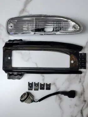 N180-FCB NISSAN Chuki Right Front Bumper Turn Signal Bracket