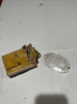 1957 Chevy Nos Delco Guide Clear Glass Back-up Lamp Lens. Fixed Price $40.00.